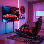 Support TV sur pied noir dans un espace gaming avec siège de simulation