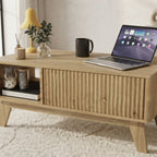 Table basse Sivren ouverte montrant son grand rangement caché sous le plateau