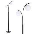 Lampadaire Elira noir à double globe dans un salon lumineux
