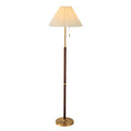Lampadaire Eloria avec abat-jour blanc plissé et structure effet bois fond blanc